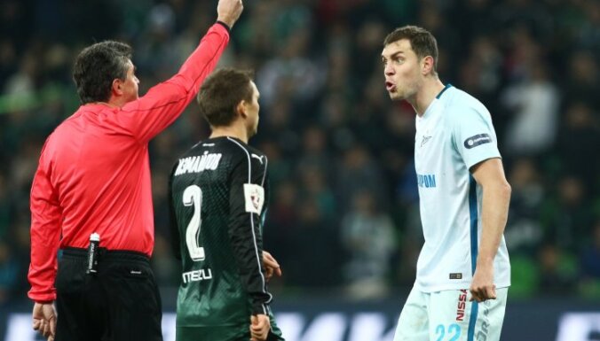 Artyom Dzyuba receives a yellow card